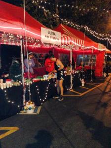 Chowing down at the aid station. (Image courtesy of Scott Laudick)